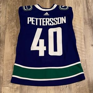 Authentic Adidas Elias Pettersson Vancouver Canucks jersey with strap. Like new